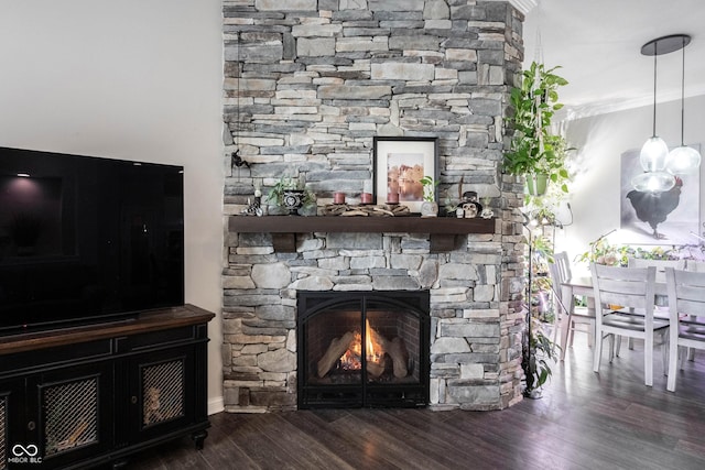 detailed view of wood finished floors and a fireplace
