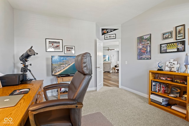 carpeted office with baseboards and ceiling fan