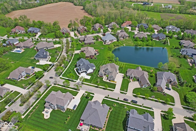 birds eye view of property featuring a residential view and a water view