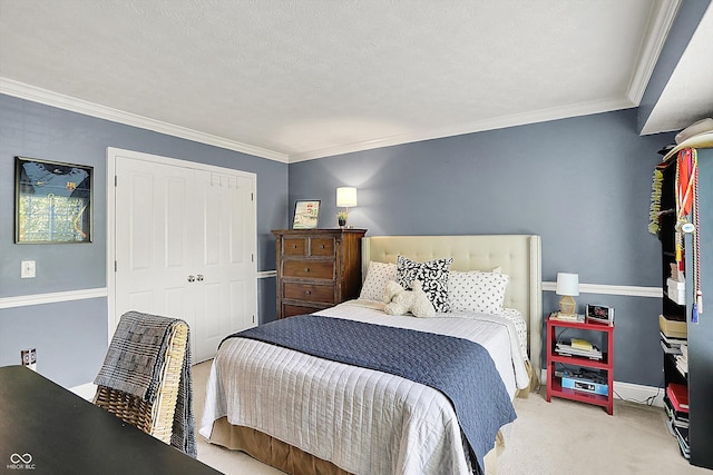 carpeted bedroom with ornamental molding, a closet, and baseboards