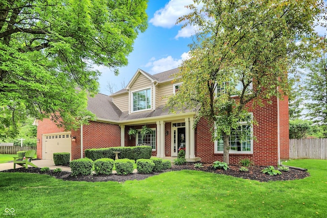 traditional-style house featuring a garage and brick siding