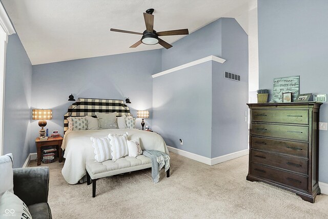 bedroom featuring vaulted ceiling, light colored carpet, baseboards, and a ceiling fan