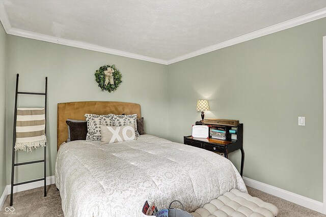 carpeted bedroom featuring baseboards and ornamental molding