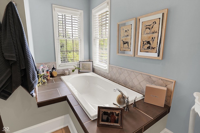 bathroom with a garden tub