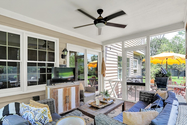 sunroom / solarium featuring an outdoor hangout area, ceiling fan, and healthy amount of natural light