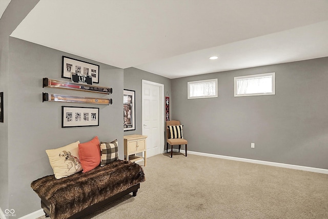 living area featuring baseboards, carpet flooring, and recessed lighting