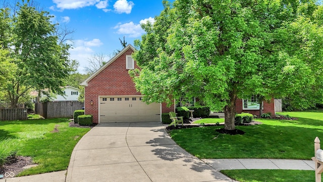 view of property hidden behind natural elements with brick siding and concrete driveway