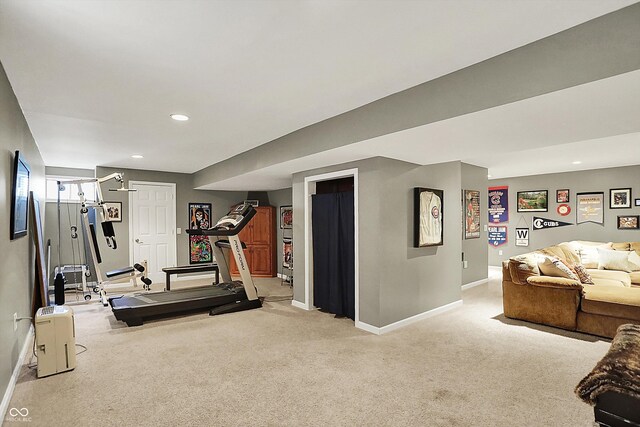 workout room with baseboards, light colored carpet, and recessed lighting