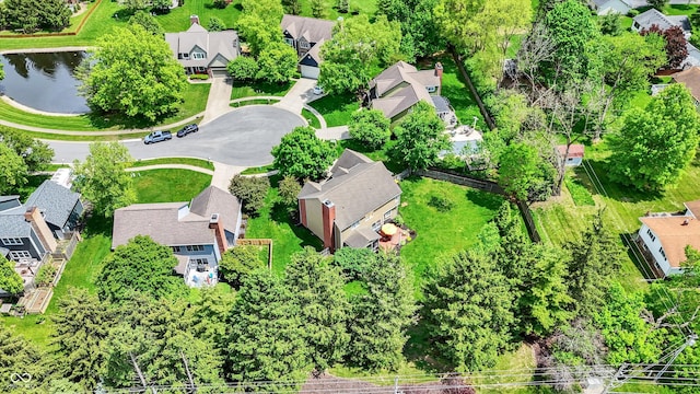 aerial perspective of suburban area featuring a large body of water