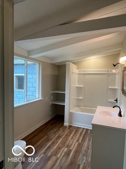 223 E Fordice St, Lebanon, IN 46052 - full bath with shower / tub combination, vanity, baseboards, wood finished floors, and beamed ceiling