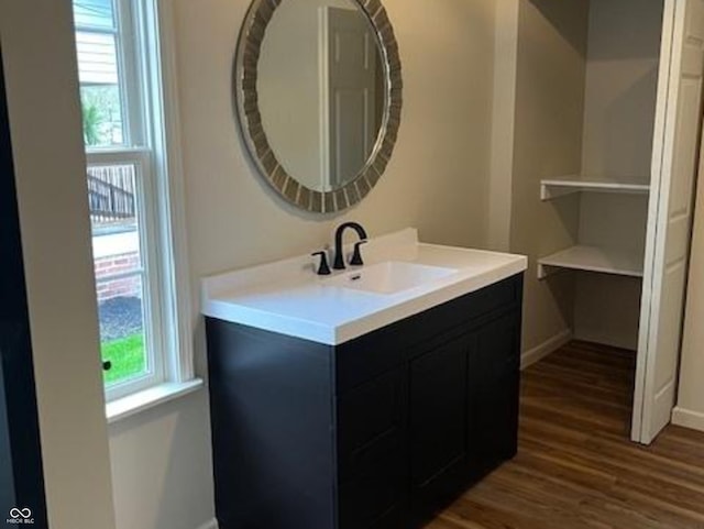 223 E Fordice St, Lebanon, IN 46052 - bathroom featuring vanity, baseboards, and wood finished floors