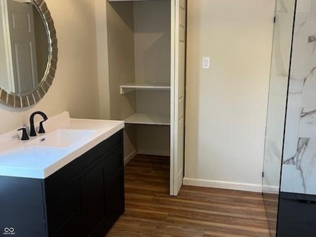 223 E Fordice St, Lebanon, IN 46052 - bathroom with baseboards, vanity, and wood finished floors