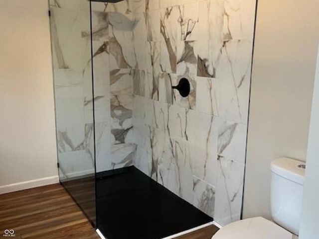 223 E Fordice St, Lebanon, IN 46052 - full bathroom with toilet, a marble finish shower, baseboards, and wood finished floors