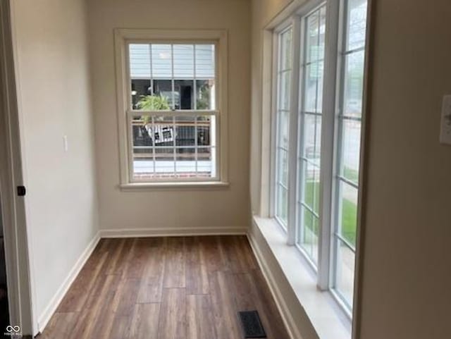 223 E Fordice St, Lebanon, IN 46052 - interior space with baseboards, dark wood finished floors, and plenty of natural light