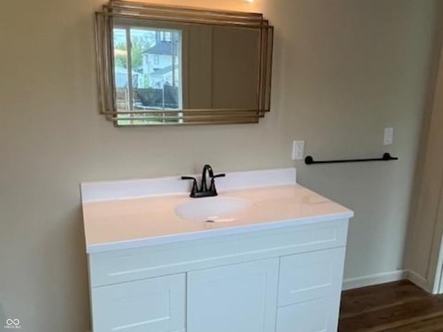 223 E Fordice St, Lebanon, IN 46052 - bathroom with wood finished floors, baseboards, and vanity