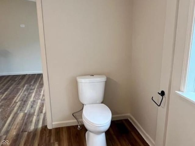 223 E Fordice St, Lebanon, IN 46052 - bathroom with toilet, baseboards, and wood finished floors