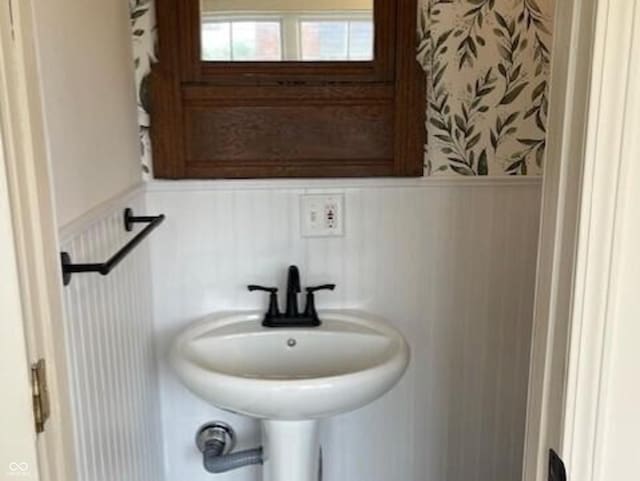 223 E Fordice St, Lebanon, IN 46052 - bathroom with wainscoting, a sink, and wallpapered walls