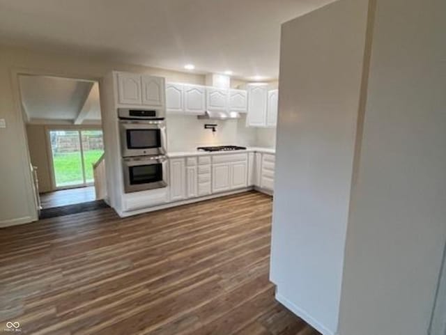 223 E Fordice St, Lebanon, IN 46052 - kitchen with gas cooktop, double oven, white cabinets, and dark wood finished floors