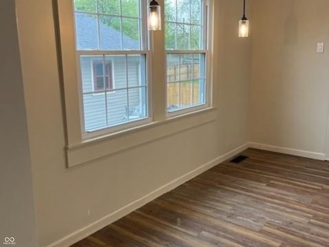 223 E Fordice St, Lebanon, IN 46052 - empty room featuring baseboards, visible vents, and dark wood finished floors