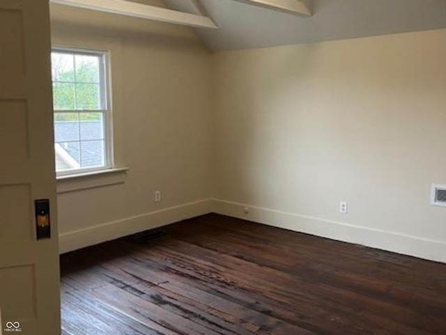223 E Fordice St, Lebanon, IN 46052 - spare room with vaulted ceiling, dark wood-style flooring, and baseboards
