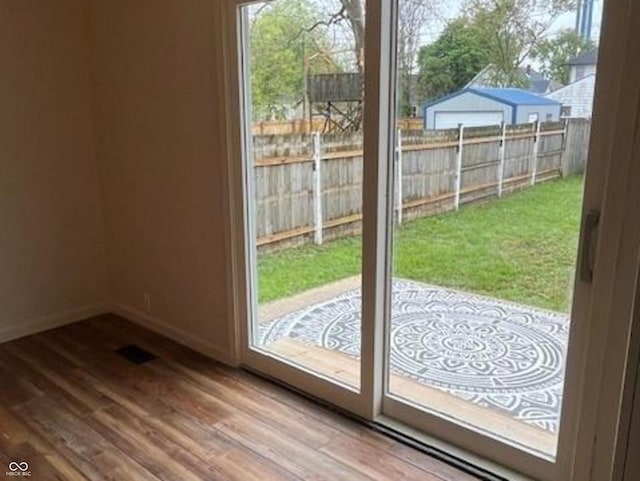 223 E Fordice St, Lebanon, IN 46052 - doorway to outside with wood finished floors and baseboards