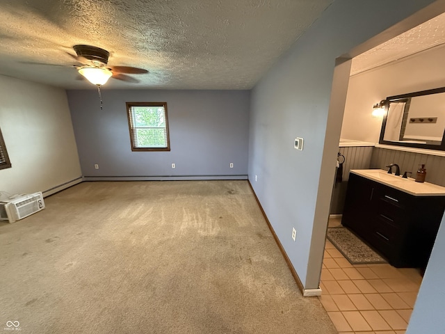 7140 N Michigan Rd, Fairland, IN 46126 - unfurnished room with ceiling fan, a textured ceiling, a sink, light carpet, and baseboards