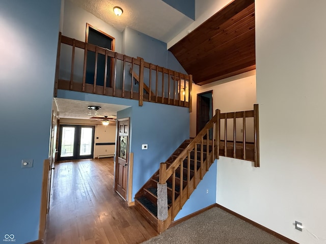7140 N Michigan Rd, Fairland, IN 46126 - staircase with baseboards, lofted ceiling, a ceiling fan, and wood finished floors