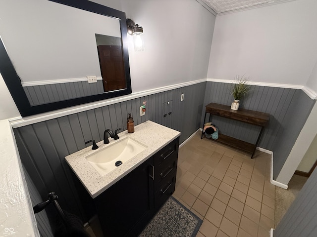 7140 N Michigan Rd, Fairland, IN 46126 - bathroom with vanity, a wainscoted wall, and tile patterned flooring