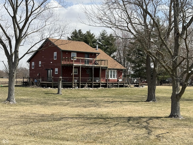 7140 N Michigan Rd, Fairland, IN 46126 - rear view of house with a wooden deck, a yard, and roof with shingles