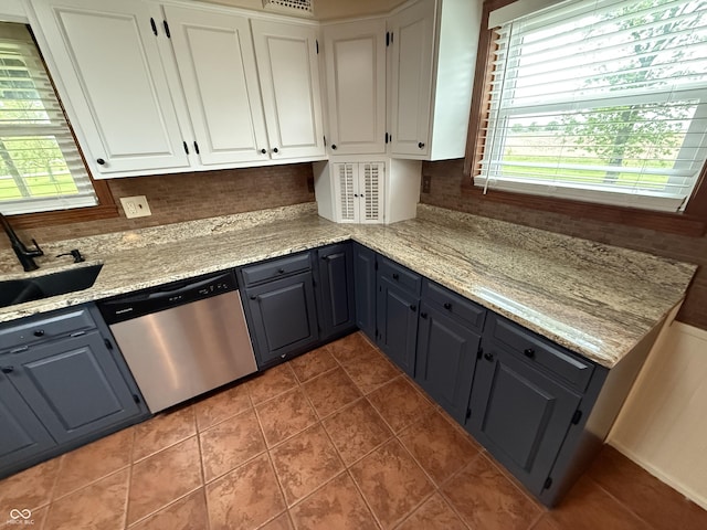 7140 N Michigan Rd, Fairland, IN 46126 - kitchen featuring dishwasher, a sink, white cabinetry, and healthy amount of natural light