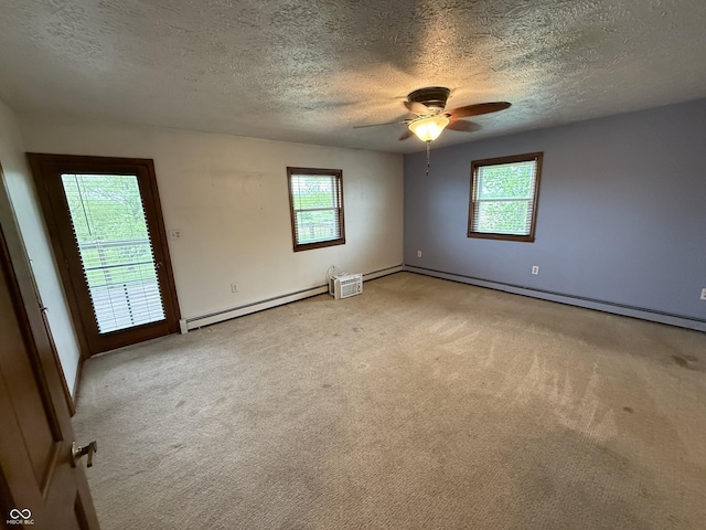 7140 N Michigan Rd, Fairland, IN 46126 - empty room featuring baseboard heating, a textured ceiling, light carpet, a ceiling fan, and baseboards