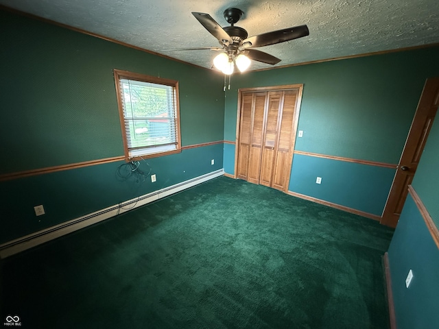 7140 N Michigan Rd, Fairland, IN 46126 - unfurnished bedroom with baseboard heating, a closet, baseboards, a textured ceiling, and carpet
