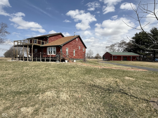 7140 N Michigan Rd, Fairland, IN 46126 - rear view of house with a deck and a yard