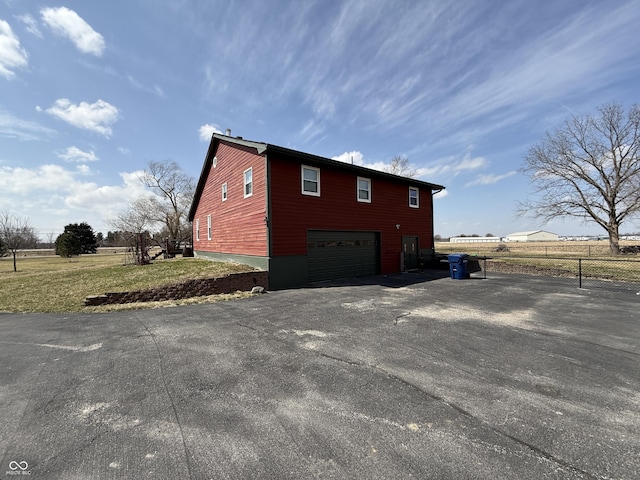 7140 N Michigan Rd, Fairland, IN 46126 - view of property exterior with asphalt driveway and a garage