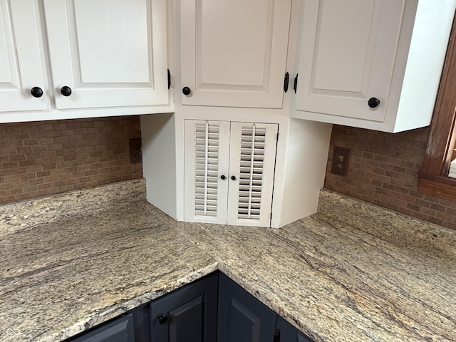7140 N Michigan Rd, Fairland, IN 46126 - kitchen view of tasteful backsplash, white cabinets, and light stone counters