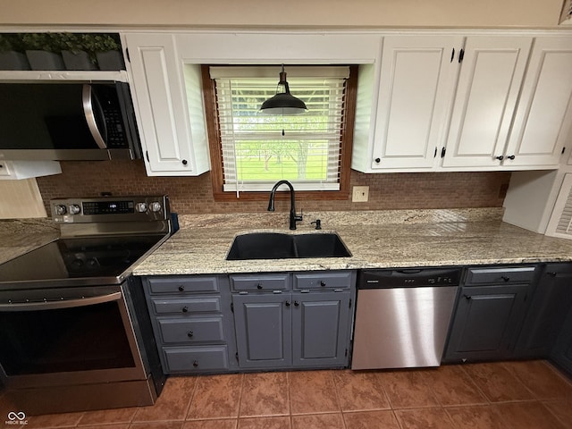 7140 N Michigan Rd, Fairland, IN 46126 - kitchen featuring appliances with stainless steel finishes, a sink, gray cabinetry, and white cabinetry