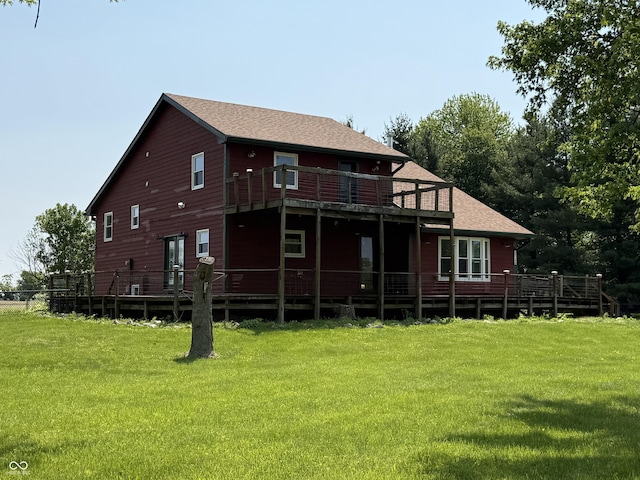 7140 N Michigan Rd, Fairland, IN 46126 - rear view of property featuring a lawn, a deck, and a shingled roof