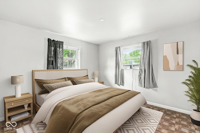 bedroom featuring baseboards