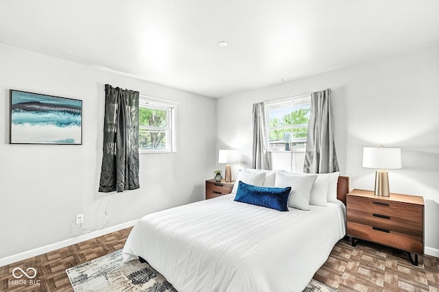 bedroom featuring baseboards