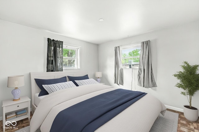bedroom featuring baseboards
