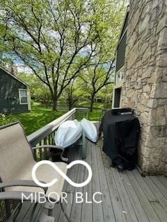 wooden terrace with area for grilling