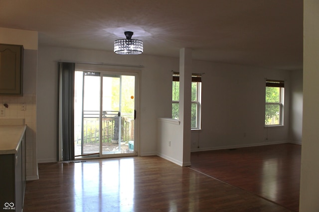 8551 Walden Trace Dr, Indianapolis, IN 46278 - unfurnished dining area with dark wood-style floors and baseboards