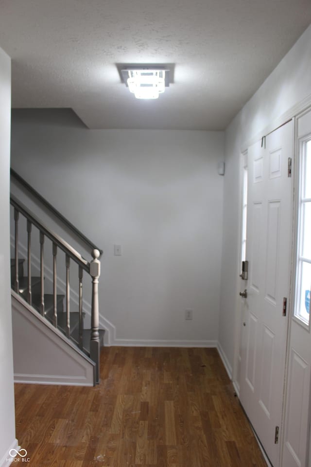 8551 Walden Trace Dr, Indianapolis, IN 46278 - foyer entrance with wood finished floors, stairway, and baseboards