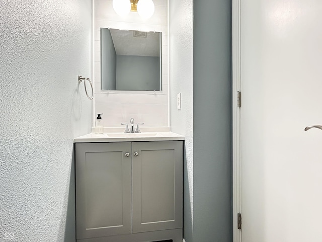 625 Streamside Dr, Greenfield, IN 46140 - bathroom featuring vanity and a textured wall