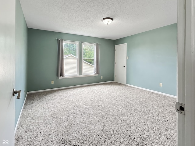 625 Streamside Dr, Greenfield, IN 46140 - unfurnished room with carpet flooring, a textured ceiling, and baseboards
