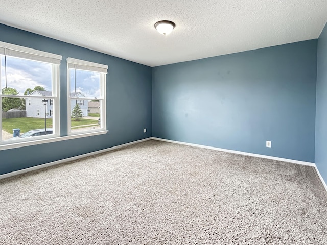 625 Streamside Dr, Greenfield, IN 46140 - carpeted empty room with a textured ceiling and baseboards