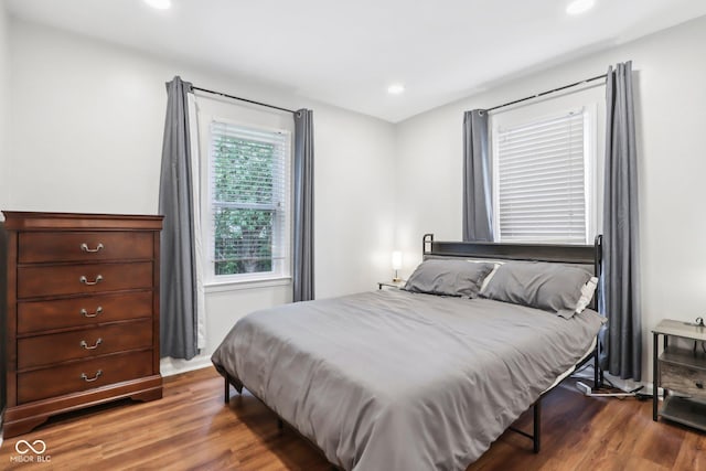 bedroom featuring wood finished floors and recessed lighting