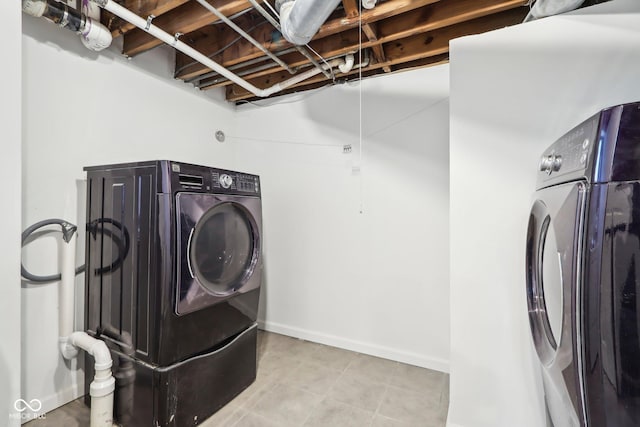 laundry room featuring separate washer and dryer and laundry area