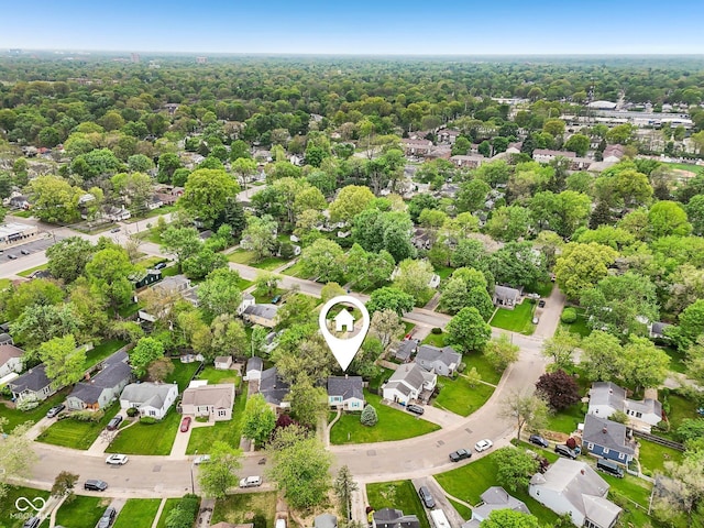 birds eye view of property with a residential view