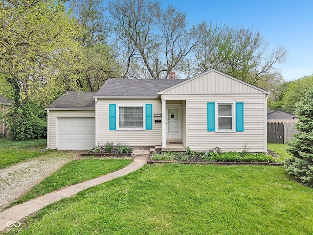 bungalow-style home with an attached garage, fence, a chimney, a front yard, and driveway